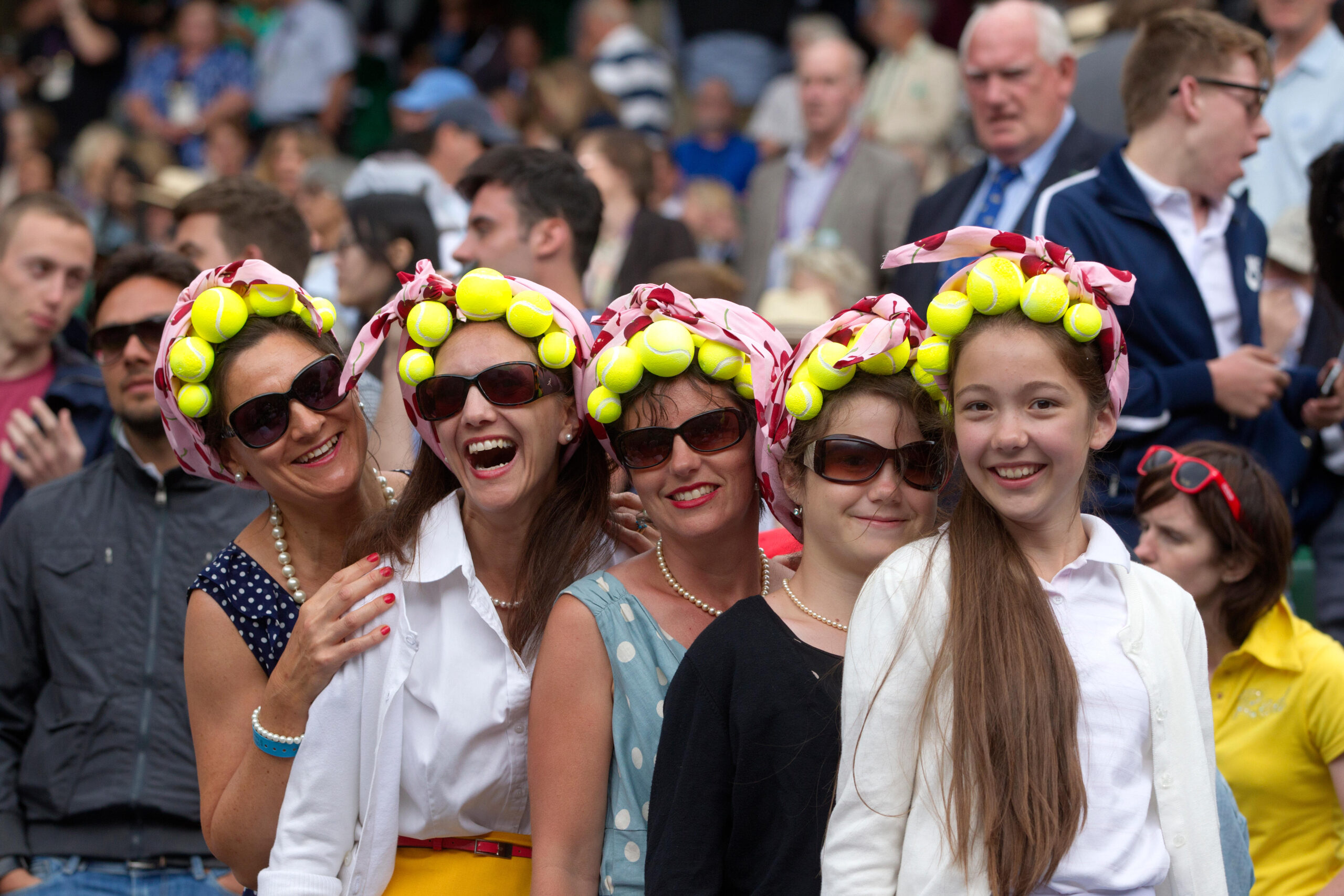 E3NY3W Wimbledon, London, UK. 26th June 2014. Picture shows tennis enthusiasts on Centre Court (left - right) Sarah Holmstrom, Wendy Evans, Jan Rossington, Zoe Rossington and Hannah Evans from Bristol enjoying this years Wimbledon Tennis Championships in Southwest London. Credit: Clickpics/Alamy Live News
